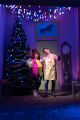 Roxy and Itai in a scene by the Christmas tree