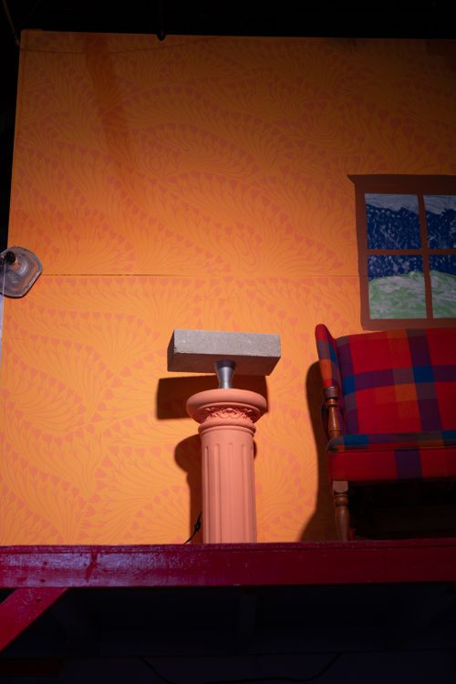Cinderblock on a plinth of the set of Edward Normalhands