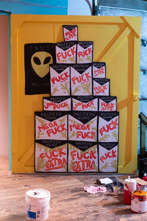 Bro Slogan's painted wall, piles of "fuck" flavored Brotein