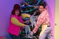Close up of Roxy and Itai with leggings hands and spatula hands by the tree